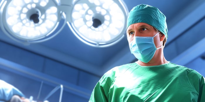 Surgeon in operating room, surgery prep, medical background photo