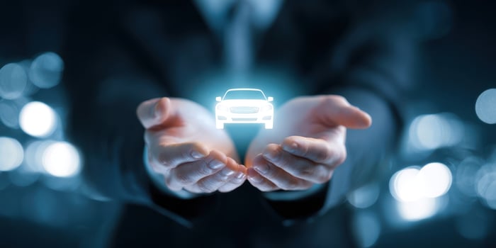 The Innovative Hologram of a Car Held in Businessman's Hands photo
