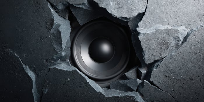 The Speaker Breaking Through a Concrete Wall with Dynamic Energy photo