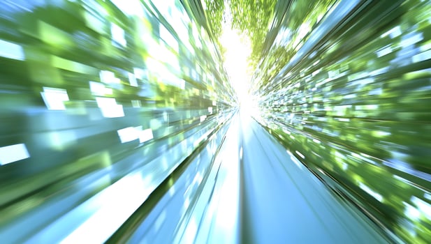 Fast train through green tunnel, bright sunlight photo