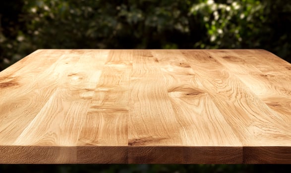 Wooden table, outdoor setting, green background, product display photo