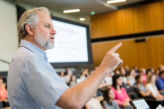 Professor lecturing students in auditorium photo