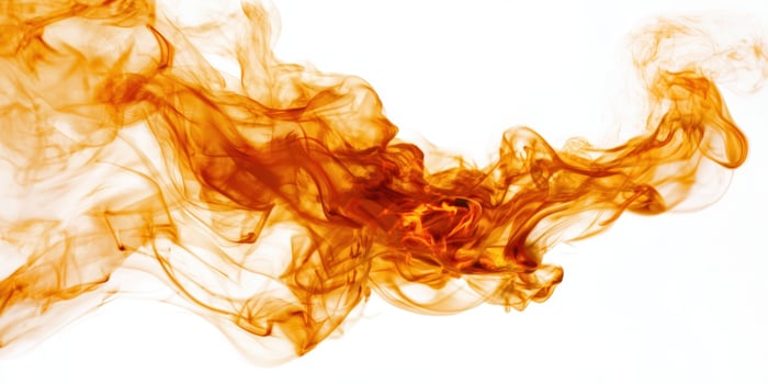 The mesmerizing dance of orange smoke captivating the viewer's imagination. photo
