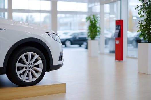 White SUV showroom display, dealership interior photo