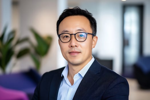 A man in glasses and a blue shirt photo