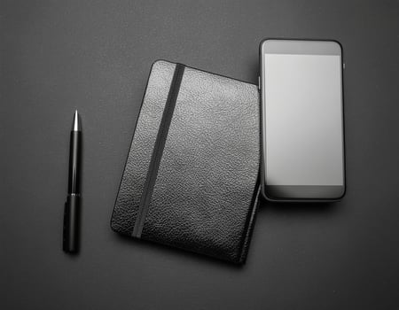 Black Smartphone, Notebook, and Pen photo