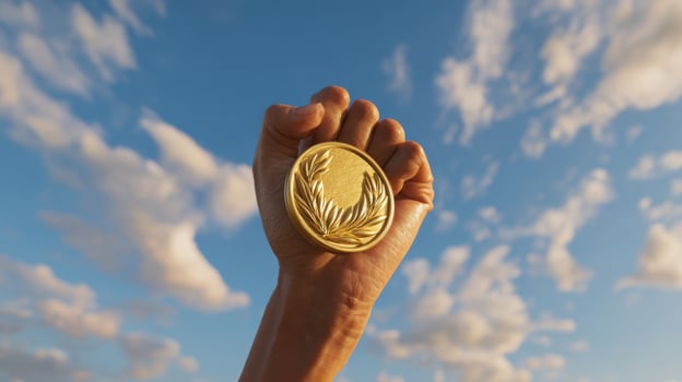 The gold medal held high against a beautiful sky symbolizes victory and achievement. photo