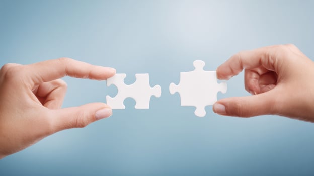 The Hands Joining Puzzle Pieces to Symbolize Connection and Collaboration photo