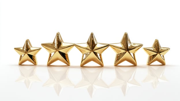 The collection of five golden stars on a reflective surface. photo