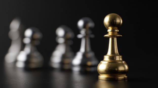 The Golden Pawn Among Silver Chess Pieces in a Strategic Game Setting photo