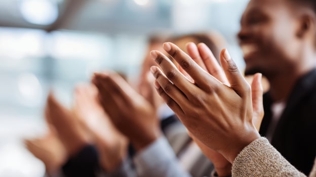 The Hands Clapping Together in Celebration at a Dynamic Event photo