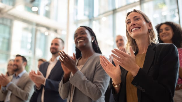 The enthusiastic audience applauding at a successful professional event. photo
