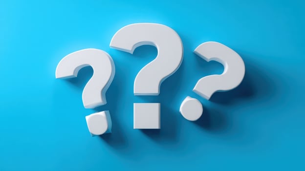 The three large white question marks against a blue background. photo
