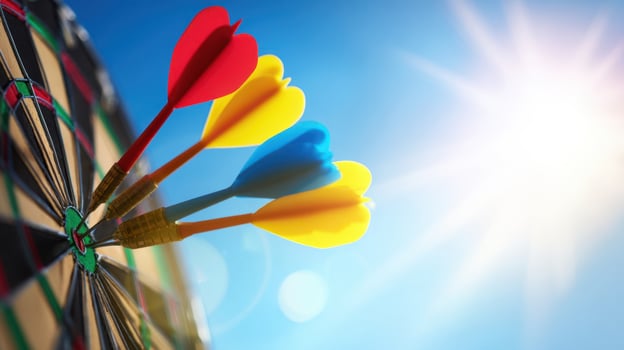 The vibrant darts striking the target in bright sunlight outdoors. photo