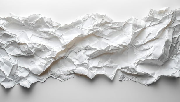 Crumpled white paper texture abstract background for graphic design and artistic elements photo