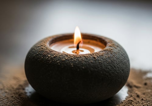 Candle in stone holder with incense ash for calm mood therapy visuals photo