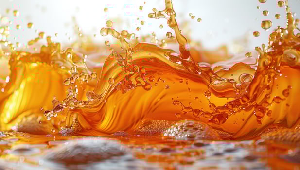 Refreshing liquid pouring with splashing action and bubbles photo