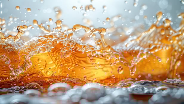 Amber liquid splash freeze motion photo