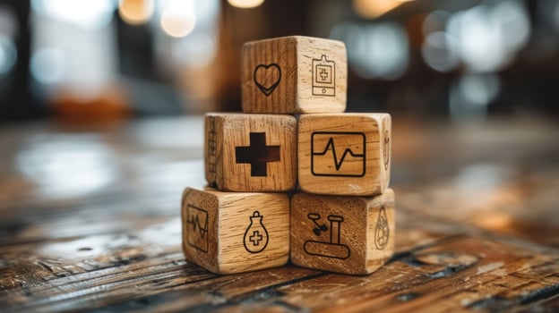 Health iconography on stacked wooden blocks for medical concepts photo