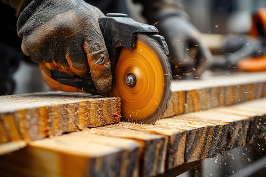 Circular saw cutting wood for carpentry or construction photo