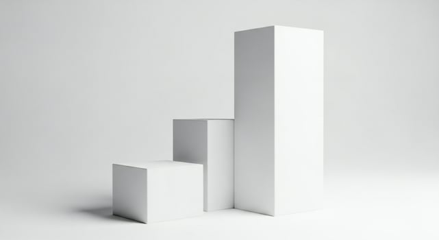 Three abstract white geometric pedestals in increasing height against a light gray background photo