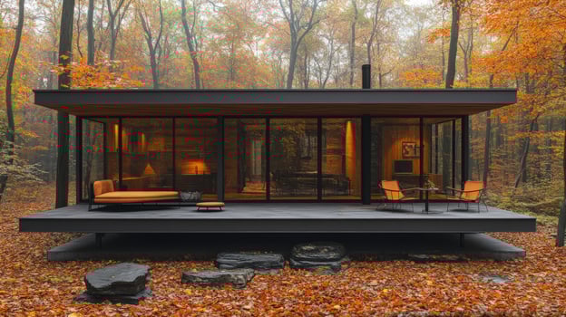 Glass house in autumn forest contemporary architecture photo