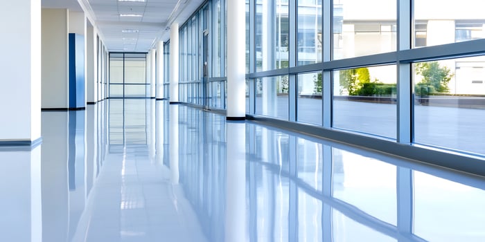 Modern office hallway, bright windows, courtyard view, corporate design photo