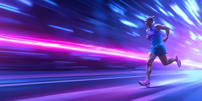 Runner speeds through neon city street photo
