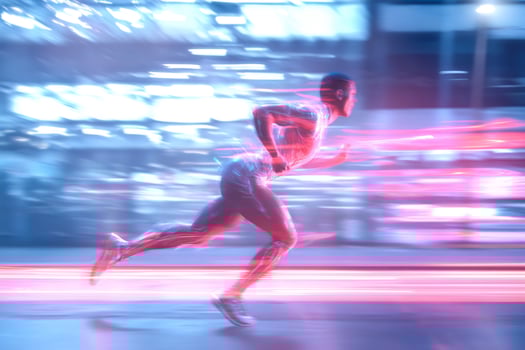 Runner sprints city street night motion blur photo
