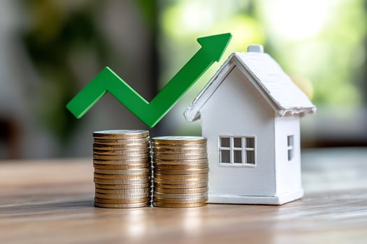 Rising house prices coins home model photo