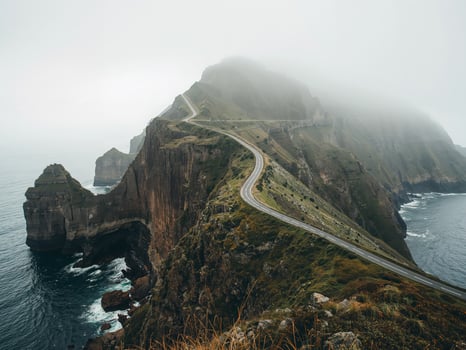 Cliffside Road Under Fog. A Scenic Coastal Highway Journey, Mountain Serpentine. photo