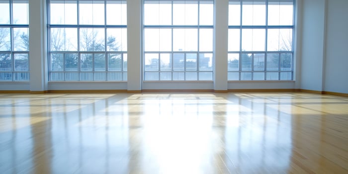 Sunny, empty room with large windows, city view photo