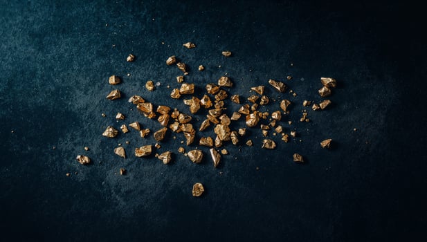 Golden Nuggets on a Dark Textured Surface, Treasure Concept, Rich and Precious. photo