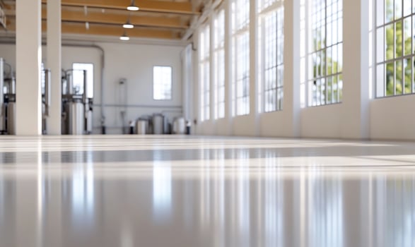 Factory interior, sunlight, polished floor, equipment, modern photo