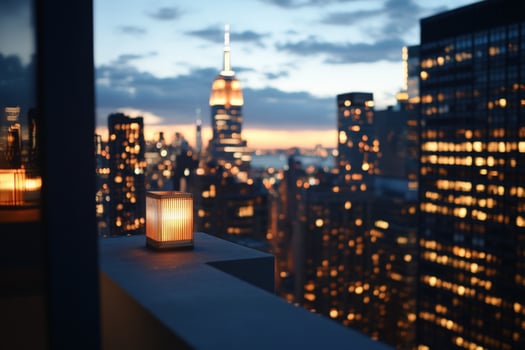 Candlelit cityscape evening view from balcony highrise with warm light and blurred buildings photo