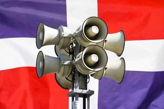 Flag of Dominican Republic. Loudspeaker on Dominican Republic flag background photo