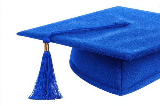 Bright blue graduation cap featuring a long tassel. Perfect for ceremonies celebrating educational achievements. The cap symbolizes success and future opportunities for graduates. photo