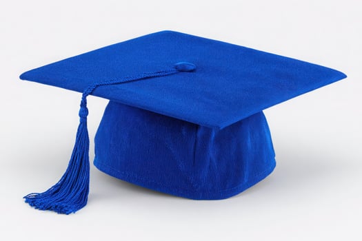 Bright blue graduation cap with a tassel sits on a plain background. The cap features a square shape and symbolizes academic achievement. It is ready for a graduation ceremony. photo