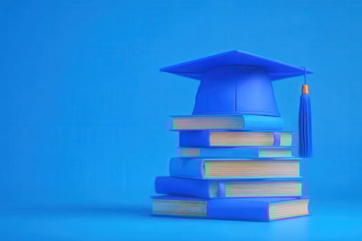 A vibrant blue graduation cap rests atop a stack of neatly arranged books against a solid blue background. This depicts the celebration of educational success and knowledge. photo