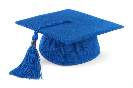 A bright blue graduation cap featuring a classic tassel is shown against a neutral background, symbolizing achievement and the completion of an academic journey, suitable for graduation ceremonies. photo