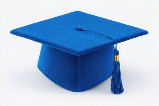 A vibrant blue graduation cap is displayed prominently against a simple background, representing educational milestones and celebrations. The tassel hanging adds a classic touch. photo