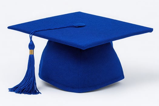 The bright blue graduation cap sits prominently, showcasing its smooth texture and long tassel. This cap symbolizes academic achievement and is perfect for graduation celebrations. photo