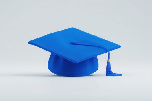 A bright blue graduation cap is prominently displayed against a plain background. The cap symbolizes academic success and is adorned with a tassel, highlighting the joy of graduation ceremonies. photo