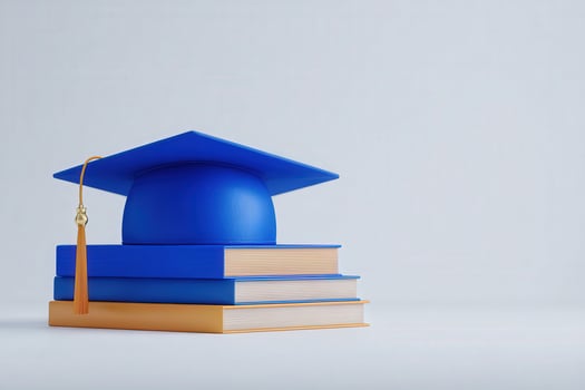 A bright blue graduation cap sits atop three stacked books in a clean, minimalist environment. This composition symbolizes achievement and the pursuit of knowledge. photo