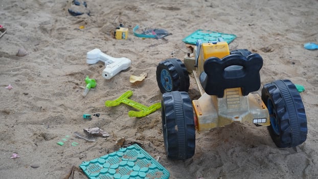 small truck and toys in the sandbox photo