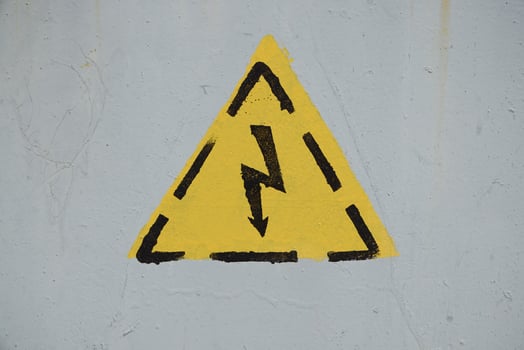 Warning Sign Symbol Indicating Potential Electrical Hazard and Associated Risks Ahead photo
