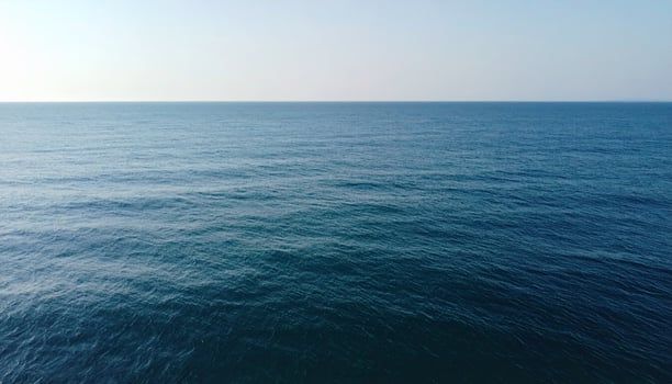 Calm Ocean View With Straight Horizon Gentle Ripples Subtle Lighting Ideal For Web Design photo