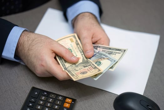 Businessman gives a bribe at the workplace photo