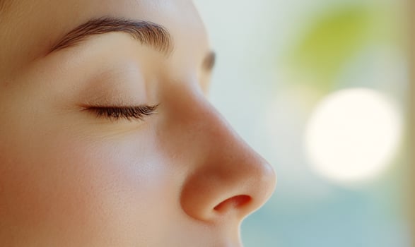 Womans face, eyes closed, peaceful, near window, spa photo