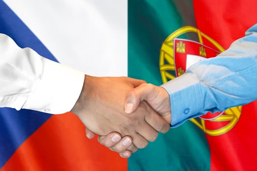 handshake on Czech Republic and Portugal flag background. photo